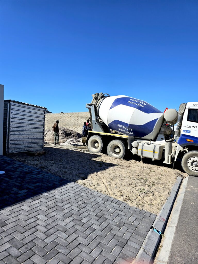 House 1 in Progress, delivering cement.